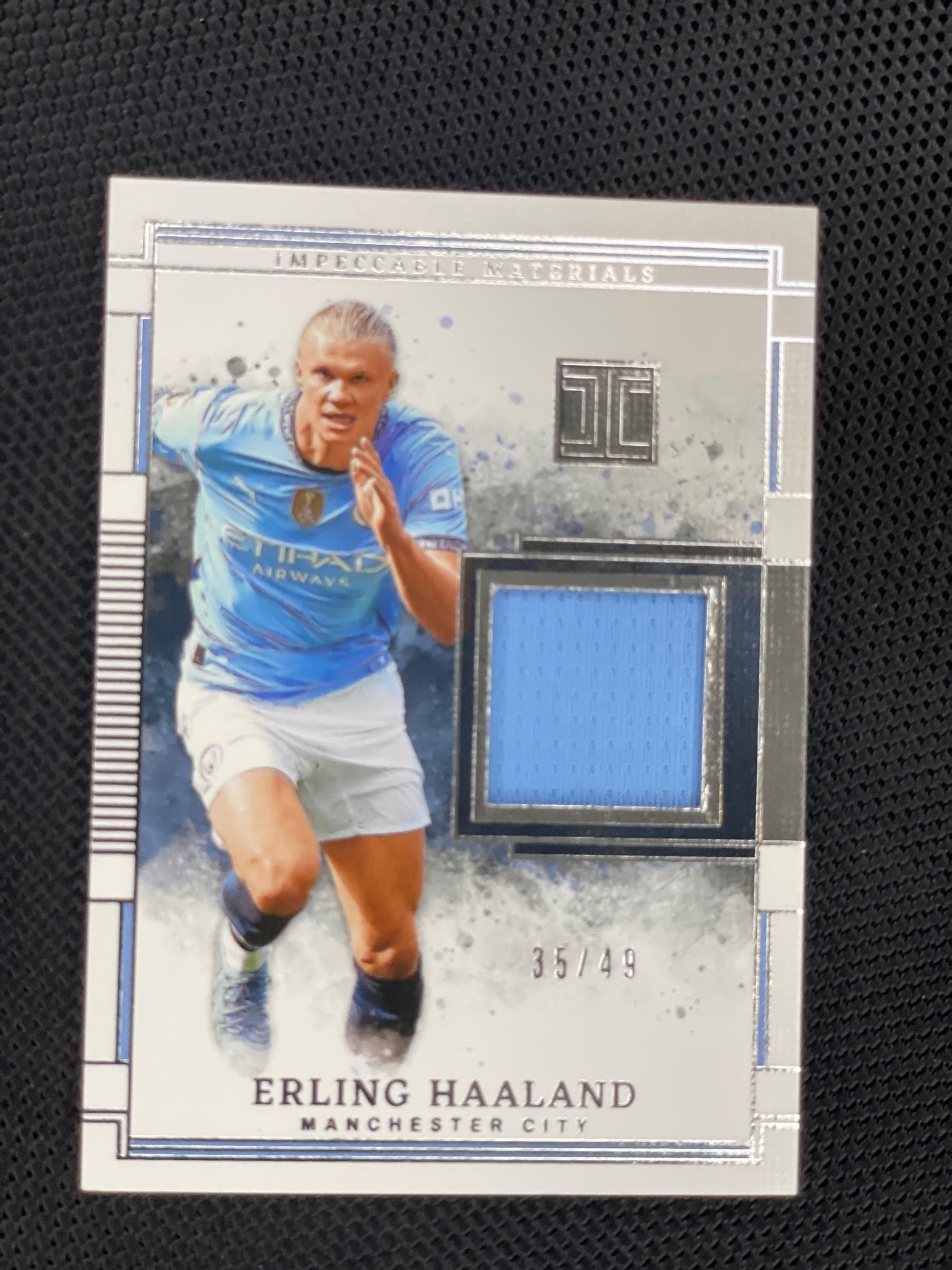 2024-25 Panini Impeccable #MA-EH Erling Haaland Impeccable Materials #/49